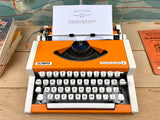 Orange Olympia Traveller Typewriter