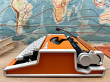 Typewriter, Orange Olympia Traveller de Luxe